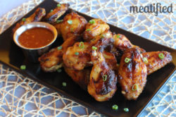 Paleo Glazed Chicken Wings from http://meatified.com. This glaze is fruit based, which means there are no added sweeteners! #paleo #whole30 #autoimmunepaleo #aip #wings #gamefood