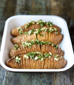 Hasselback Sweet Potatoes with Compound Herb Ghee from The Performance Paleo Cookbook