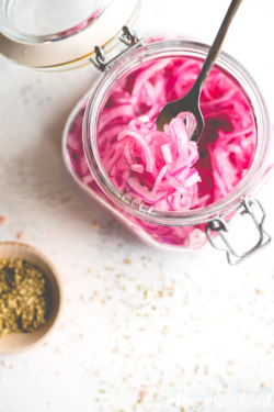 Your new favorite condiment, these simple Lime Pickled Red Onions from http://meatified.com add pizazz to tacos, salads, grilled meats and more with their vibrant hue & fresh flavor.