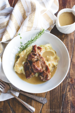Instant Pot your way to these cider braised country ribs from https://meatified.com, a Fall favorite dish paired with creamy whipped sweet potatoes and comforting apple onion gravy.