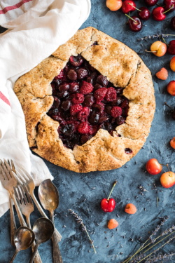 Barely sweetened summer berries & cherries nestle in the flaky, buttery crust wrapped around this cherry galette from https://meatified.com... that just happens to be grain, dairy, egg, nut, seed & coconut free! Oh, and straight up delicious.
