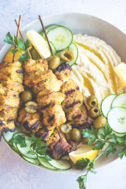 These Mediterranean chicken skewers from https://meatified.com are perfect for summer, with a lemony spiced marinade that pairs perfectly with this creamy bean-less artichoke dip.