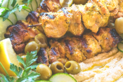 These Mediterranean chicken skewers from https://meatified.com are perfect for summer, with a lemony spiced marinade that pairs perfectly with this creamy bean-less artichoke dip.