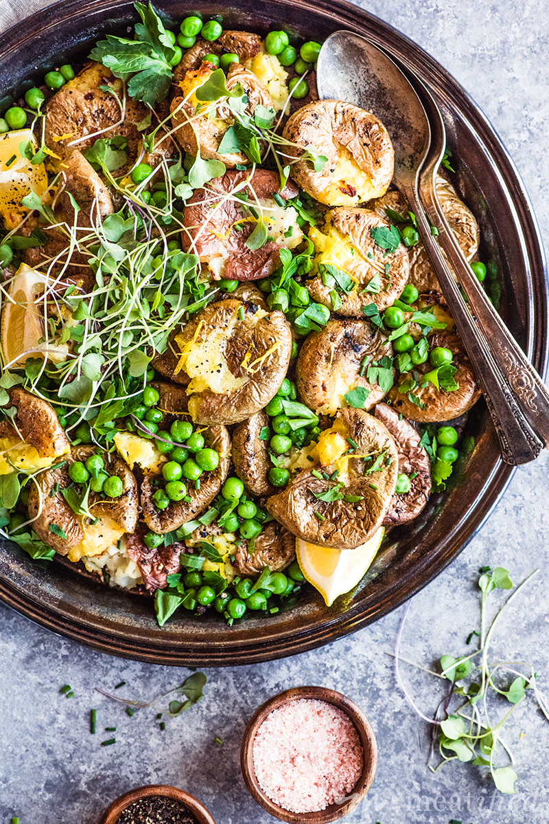 These zesty lemon smashed potatoes from https://meatified.com are crispy on the outside, fluffy in the middle and all tangled up with bright peas & herbs for a lighter, Spring-y take on spuds.
