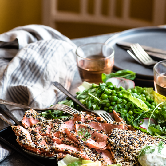 This everything bagel salmon is super simple, paired with a fun take on green salads and a silky caper sauce that brings everything together with a punch.