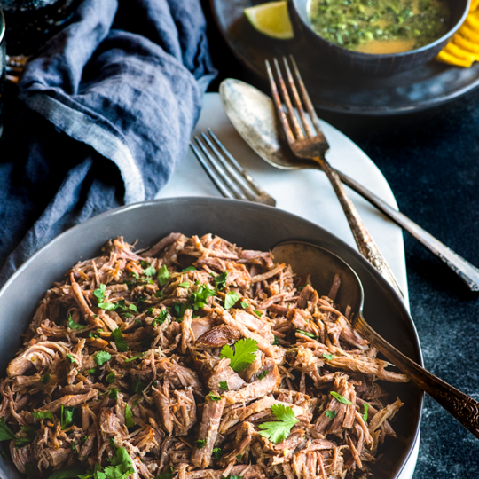 This fragrant, cumin scented mojo pulled pork is juicy-tender, with a citrusy sauce that all comes together in a fraction of the time in the Instant Pot.