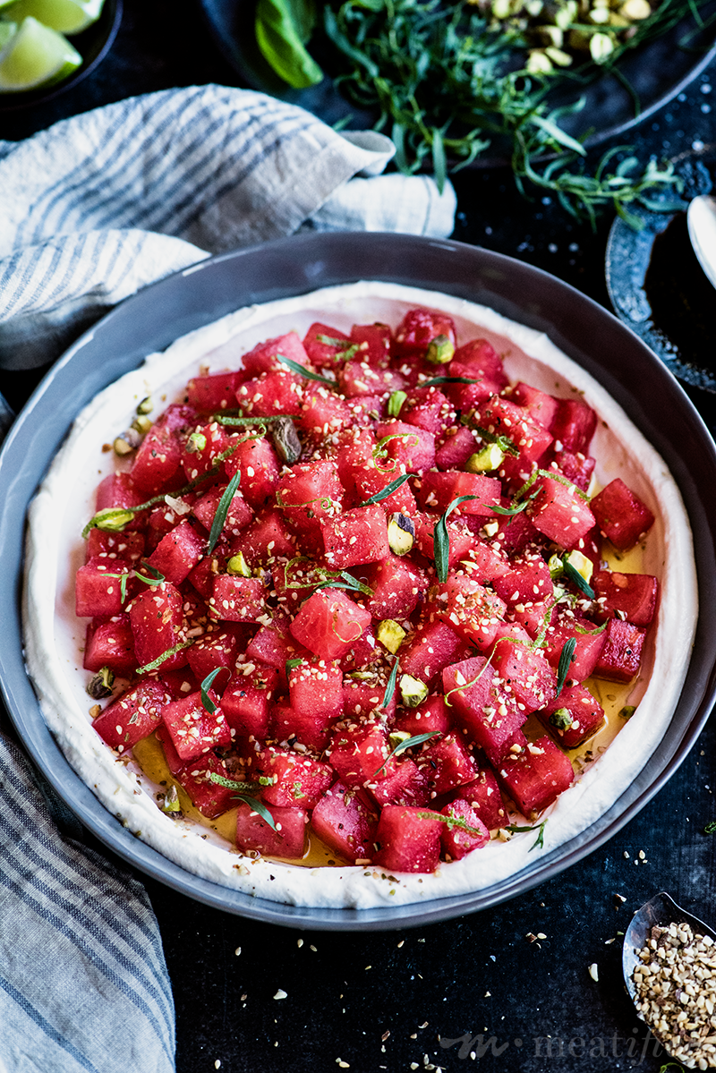 Feta doesn't get to have all the fun! This watermelon salad is crisp, creamy & studded with a savory spiced seasoning, then finished with fruity olive oil.