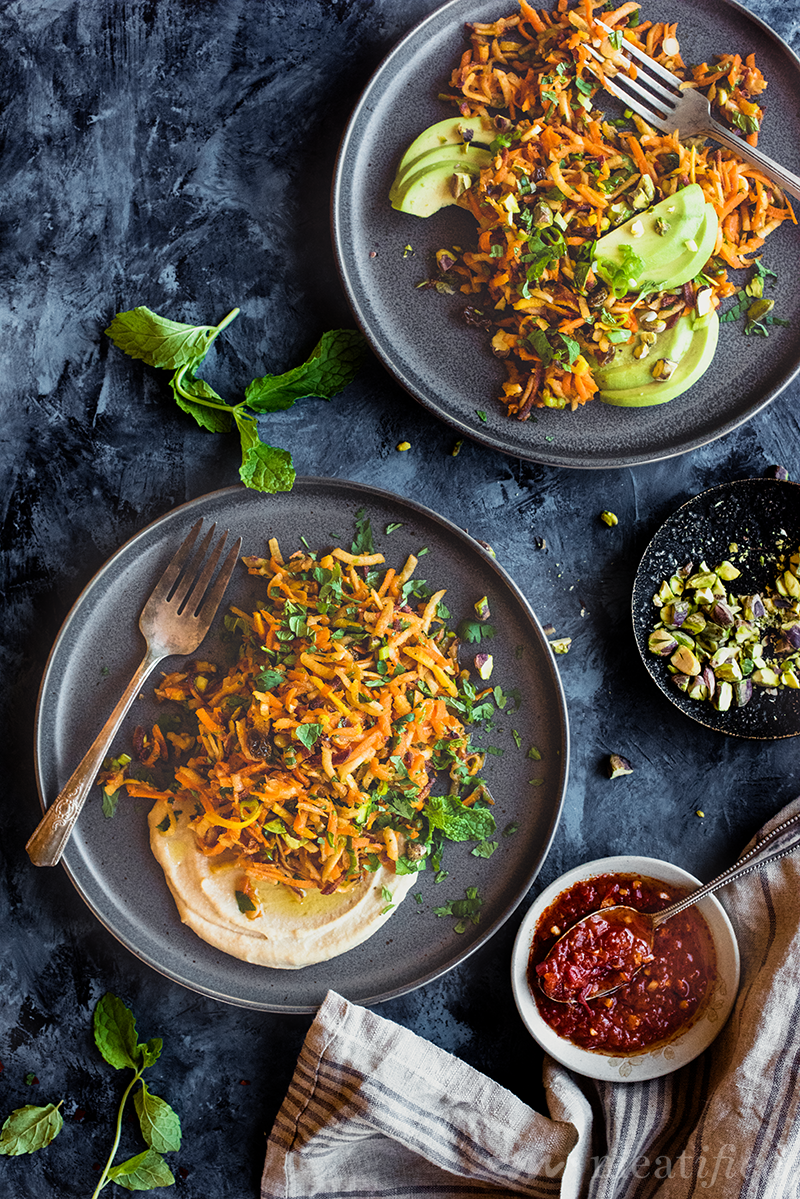 With summer comes my favorite make ahead harissa carrot salad! It's light & crisp, sweet & spicy, packed with fresh herbs, lemon zest & a hint of garlic.