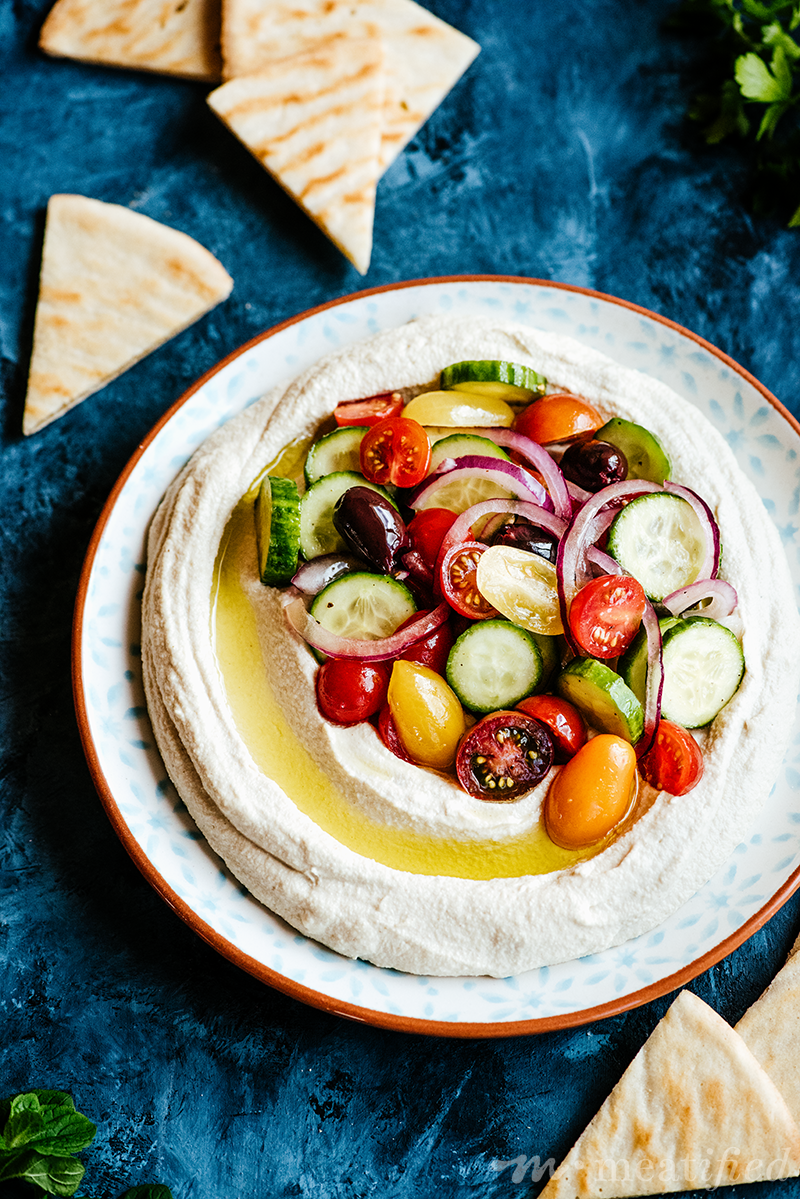 This silky smooth hummus leaves out the legumes but brings all the flavor, brightened with crunchy, fresh Mediterranean salad for the perfect summery meal.