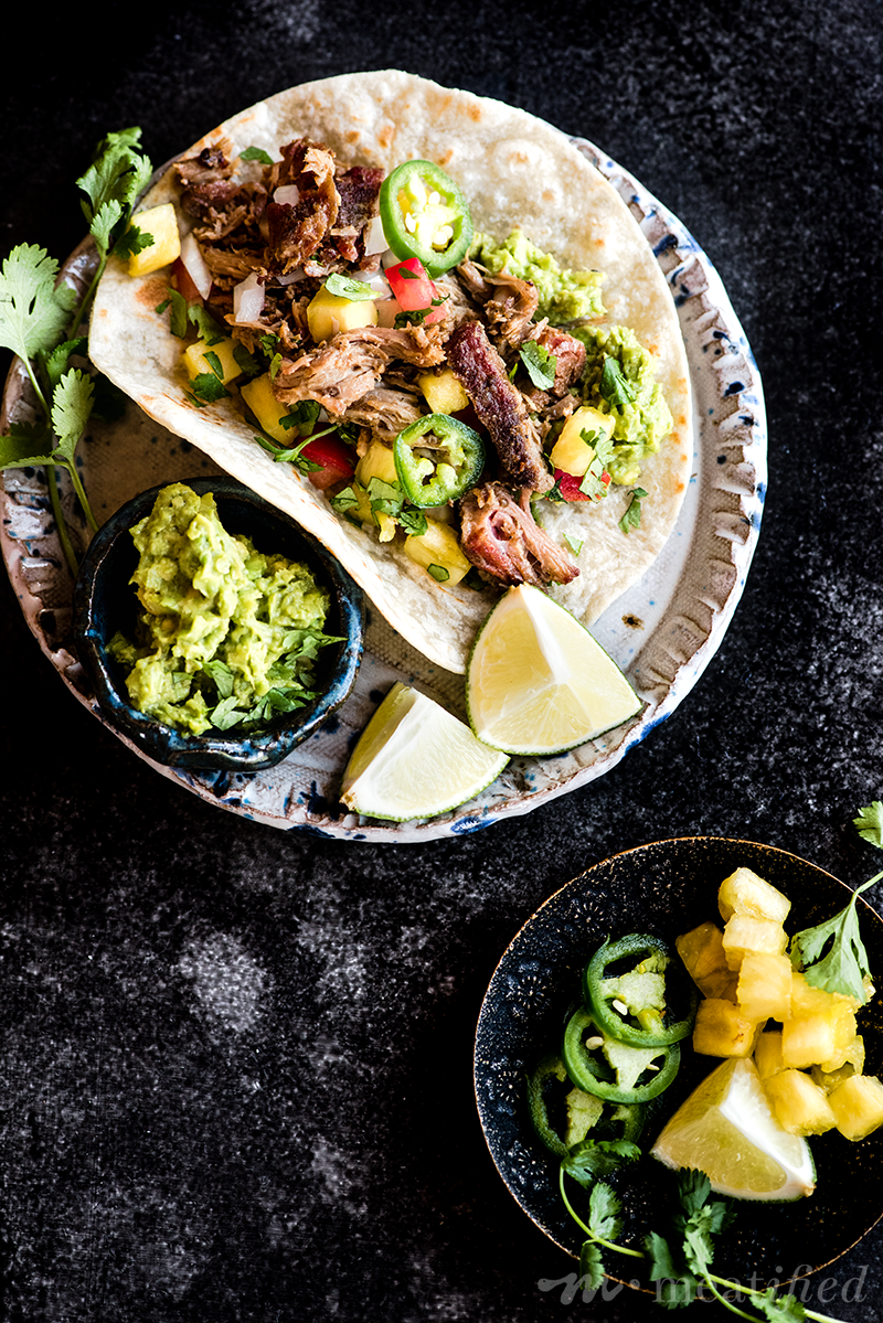 Your new favorite taco is here! These smoked pork carnitas tacos are piled high with crispy seasoned pork & an easy summer inspired pineapple salsa.