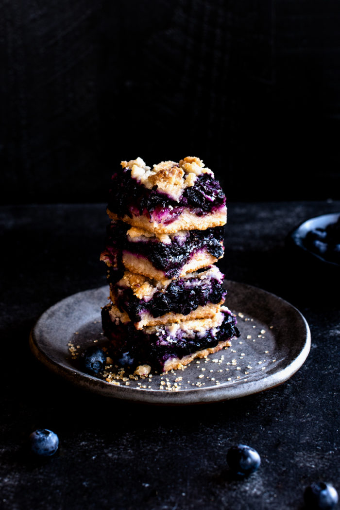 These blueberry pie bars have a crisp, buttery crust piled high with blueberries & a crumble-y top for a perfectly portable take on pie.